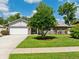 Charming single-story home with a well-maintained lawn and attached garage in a desirable neighborhood at 934 Tall Pine Dr, Port Orange, FL 32127