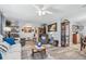 Comfortable living room with neutral tones and seamless transition to dining room at 934 Tall Pine Dr, Port Orange, FL 32127