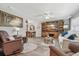 Open-concept living room with neutral decor, hardwood floors, and stylish furnishings at 934 Tall Pine Dr, Port Orange, FL 32127