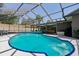 Enclosed in ground pool featuring a screened lanai for relaxation and privacy at 934 Tall Pine Dr, Port Orange, FL 32127