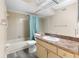 Bathroom featuring a vanity, mirror, bathtub, and shower combination at 1 Tomoka Oaks Blvd # 135, Ormond Beach, FL 32174