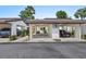 Well-maintained carports offer convenient covered parking, adjacent to the front entrance at 1 Tomoka Oaks Blvd # 135, Ormond Beach, FL 32174