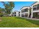 Exterior elevation showcasing the home's well-manicured front lawn and landscaping at 1 Tomoka Oaks Blvd # 135, Ormond Beach, FL 32174