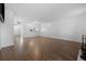 Bright living room with hardwood floors, ideal for gatherings, and seamless transition into the kitchen area at 1 Tomoka Oaks Blvd # 135, Ormond Beach, FL 32174