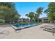 Inviting community pool surrounded by mature trees and manicured grounds, perfect for relaxation at 1 Tomoka Oaks Blvd # 135, Ormond Beach, FL 32174