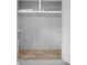 Small storage space with tile floor and simple shelving units at 1 Tomoka Oaks Blvd # 135, Ormond Beach, FL 32174
