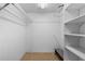 Spacious walk-in closet with carpet flooring and shelving for optimal storage at 1 Tomoka Oaks Blvd # 135, Ormond Beach, FL 32174
