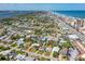 Panoramic aerial view of the neighborhood, home, ocean and intercoastal waterway at 129 Dundee Rd, Daytona Beach, FL 32118