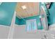 Cozy bathroom with beadboard walls, white fixtures and shower curtain at 129 Dundee Rd, Daytona Beach, FL 32118