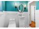 Stylish bathroom features a modern sink vanity, decorative mirror, and sleek fixtures, enhancing the room's ambiance at 129 Dundee Rd, Daytona Beach, FL 32118