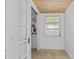 Cozy room/closet features a wood paneled ceiling and a window for natural light at 129 Dundee Rd, Daytona Beach, FL 32118