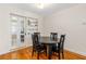 Bright dining area featuring hardwood floors, built-in shelving and a modern light fixture at 129 Dundee Rd, Daytona Beach, FL 32118