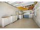 Spacious garage with laundry area, offering ample storage and utility space for convenience and organization at 129 Dundee Rd, Daytona Beach, FL 32118