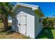 Close-up shot of the storage shed nestled in the backyard at 129 Dundee Rd, Daytona Beach, FL 32118