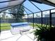 Enclosed backyard spa area features a covered hot tub, providing a private and relaxing oasis at 13 Sunrise Ave, Ormond Beach, FL 32176