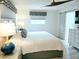 Calm bedroom featuring a plush bed, modern nightstands, and tasteful window coverings at 13 Sunrise Ave, Ormond Beach, FL 32176