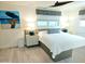Relaxing bedroom with stylish decor, window treatments, and comfortable furnishings at 13 Sunrise Ave, Ormond Beach, FL 32176