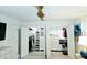 A well-organized closet with shelves, drawers, and hanging space provides ample storage solutions at 13 Sunrise Ave, Ormond Beach, FL 32176