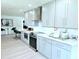 Contemporary kitchen with stainless steel appliances, modern fixtures, and eat-in bar at 13 Sunrise Ave, Ormond Beach, FL 32176