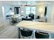 Bright living room with stylish furnishings, modern lighting, and an open layout to the kitchen at 13 Sunrise Ave, Ormond Beach, FL 32176