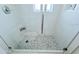 Sleek shower with glass door, tiled walls, and modern fixtures for a luxurious bathing experience at 13 Sunrise Ave, Ormond Beach, FL 32176
