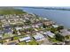 Waterfront home with easy access to the river and ocean, showcasing mature landscaping and neighborhood charm at 136 Reef Rd, South Daytona, FL 32119