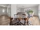Inviting dining area flowing into the living room, complemented by natural light and stylish furnishings at 136 Reef Rd, South Daytona, FL 32119