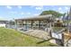 Outdoor dock with boat lift, offering waterfront access and views on a sunny day at 136 Reef Rd, South Daytona, FL 32119