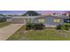Charming single-story home featuring well-maintained lawn, an attached garage, and neutral paint scheme at 136 Reef Rd, South Daytona, FL 32119