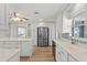 Spacious kitchen with stainless appliances, granite countertops, a large island, and seamless access to dining and living areas at 136 Reef Rd, South Daytona, FL 32119