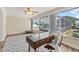 Home office boasting an inviting work space with a modern desk, chair, and serene poolside views at 136 Reef Rd, South Daytona, FL 32119