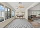 Bright home office featuring large windows, wood floors, modern decor, and backyard views at 136 Reef Rd, South Daytona, FL 32119