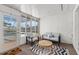 Inviting sunroom features a seating area, neutral color palette, and natural light, perfect for relaxation at 136 Reef Rd, South Daytona, FL 32119
