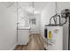 Functional utility room with sink, cabinets, shelves, and space for organizing household essentials at 136 Reef Rd, South Daytona, FL 32119