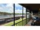 Relaxing screened balcony overlooking the water and private boat dock at 1640 Juno Trl # 202E, Astor, FL 32102