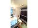 Bathroom with modern fixtures and stylish striped shower curtain at 1640 Juno Trl # 202E, Astor, FL 32102