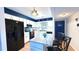 Bright kitchen with modern white cabinets, stainless steel appliances, and a granite countertop island at 1640 Juno Trl # 202E, Astor, FL 32102