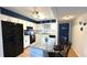 Well-lit kitchen with modern white cabinets, stainless steel appliances, and a granite countertop island at 1640 Juno Trl # 202E, Astor, FL 32102