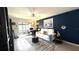 Cozy living area with stylish furnishings, tile floors, and balcony access, perfect for relaxation at 1640 Juno Trl # 202E, Astor, FL 32102