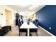 Open-concept living and dining area with modern furnishings, tile floors, and plenty of natural light at 1640 Juno Trl # 202E, Astor, FL 32102