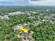Aerial view of a neighborhood, highlighting the property's location with mature trees and green surroundings at 2101 Almond St, Orange City, FL 32763