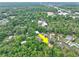 Expansive aerial view of a property nestled within lush, green surroundings at 2101 Almond St, Orange City, FL 32763