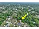 Overhead view of a house surrounded by trees in a serene residential neighborhood at 2101 Almond St, Orange City, FL 32763