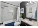 Stylish bathroom featuring marble-look tile, a shower with a tub, and modern fixtures at 2101 Almond St, Orange City, FL 32763