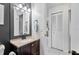 Well-lit bathroom with sleek vanity, modern fixtures, and storage at 2101 Almond St, Orange City, FL 32763