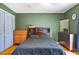 The primary bedroom offers hardwood floors, an ensuite bath, and ample closet space at 2101 Almond St, Orange City, FL 32763
