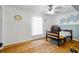 Bright bedroom featuring hardwood floors and modern wall decor at 2101 Almond St, Orange City, FL 32763