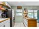 A kitchen with stainless steel appliances, butcher block countertops, and white subway tile at 2101 Almond St, Orange City, FL 32763