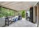 The covered patio has a full grill and provides a seamless indoor-outdoor experience at 2101 Almond St, Orange City, FL 32763