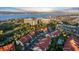Stunning aerial view of the community, showing the red-tiled roofs, lush landscaping, and waterfront location at 2934 Oceans Trce, Daytona Beach Shores, FL 32118
